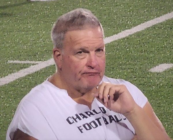 Biff Poggi, head coach at Charlotte and Michigan