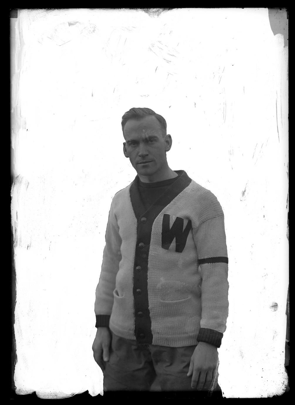 UW football player in 'W' cardigan