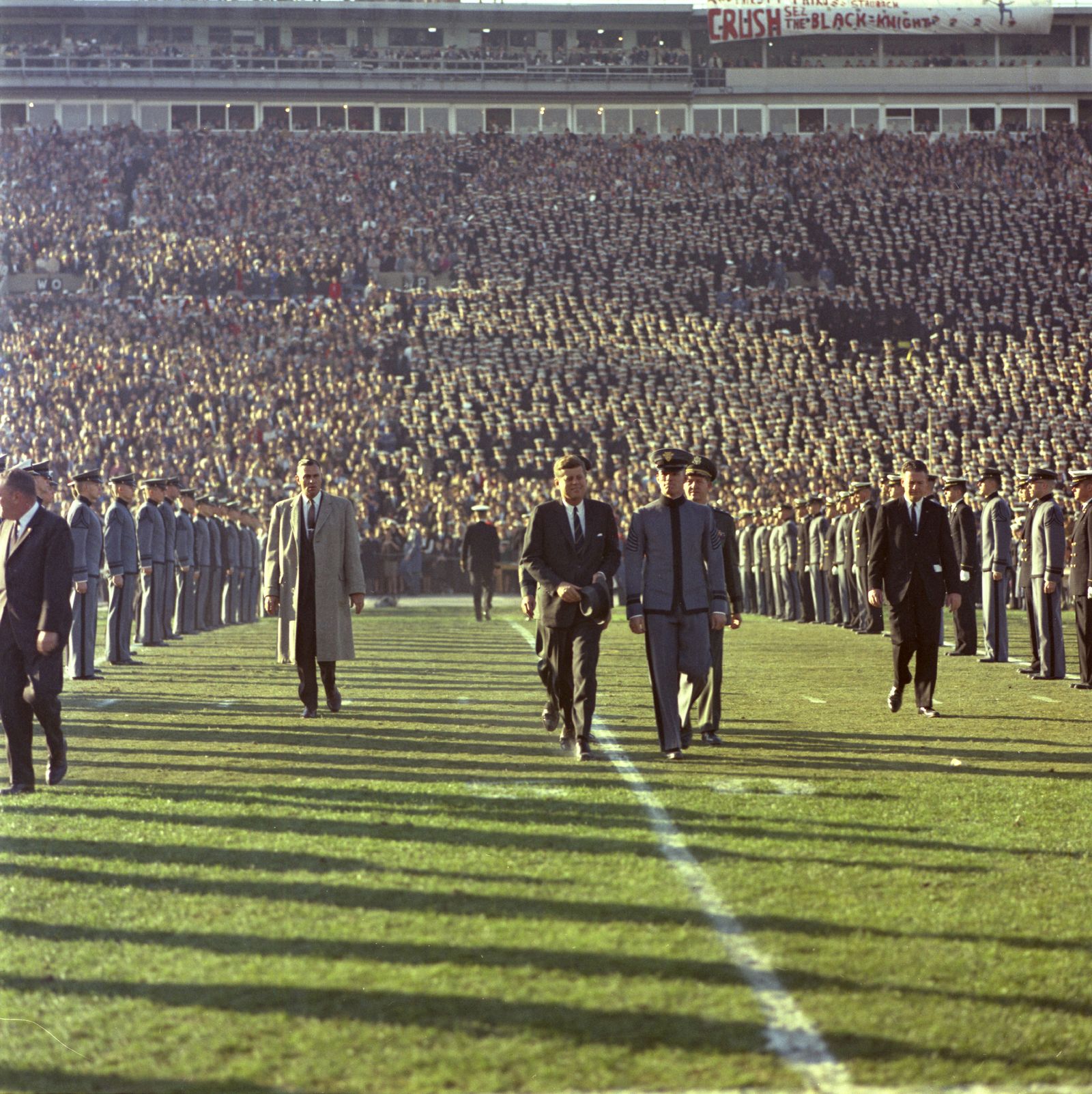 President Kennedy is Escorted across the Field by an Unidentified Cadet and General Clifton during Halftime of the Army-Navy Football Game, Philadelphia Municipal Stadium