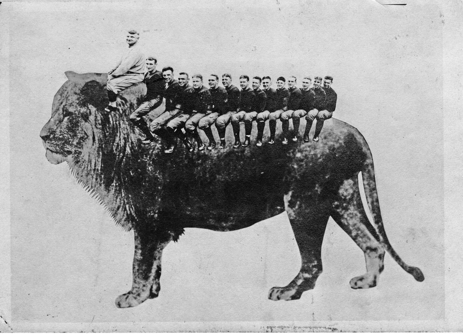 Coach Bezdek and the football team riding on a lion