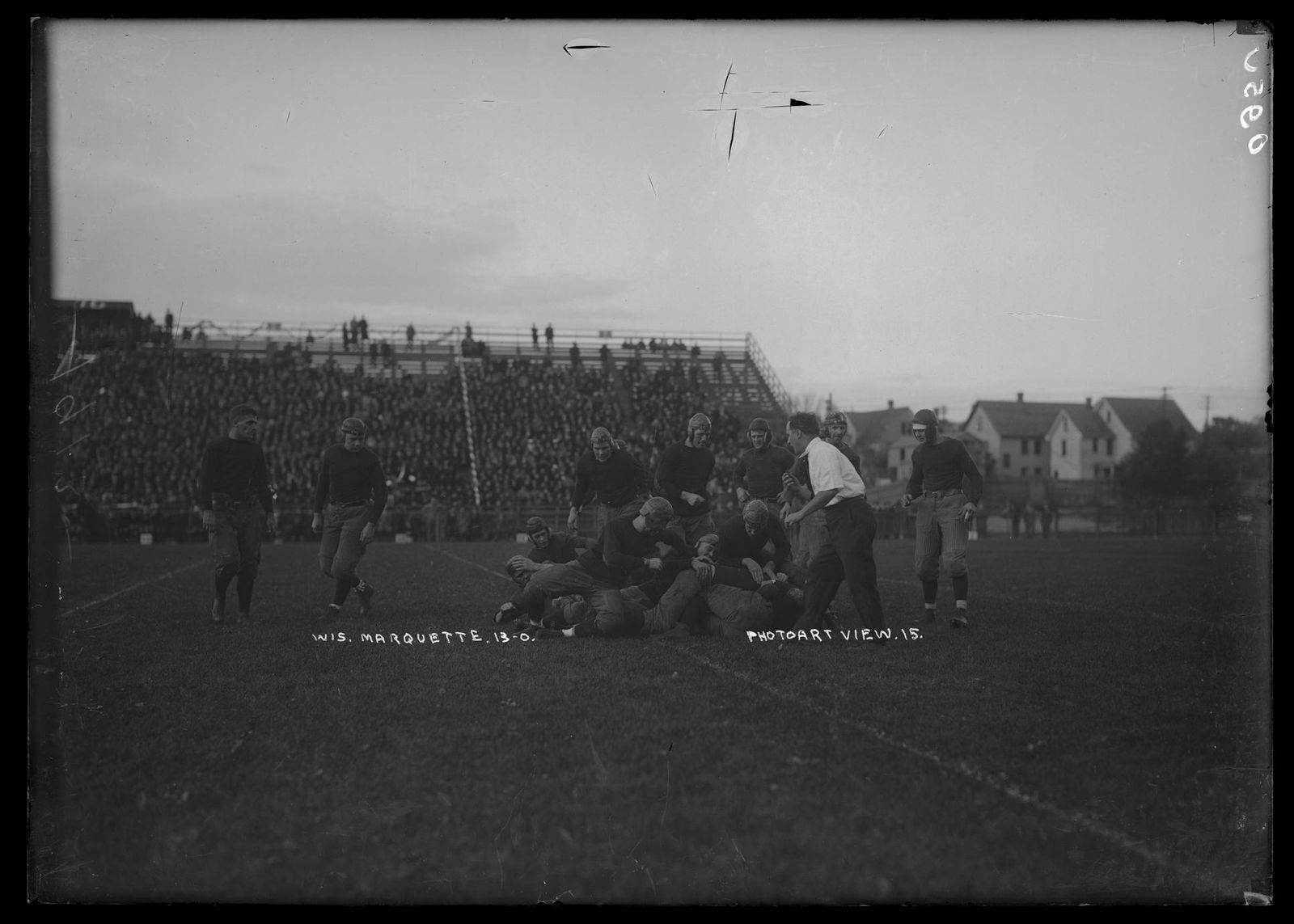 Players on the field, UW vs. Marquette