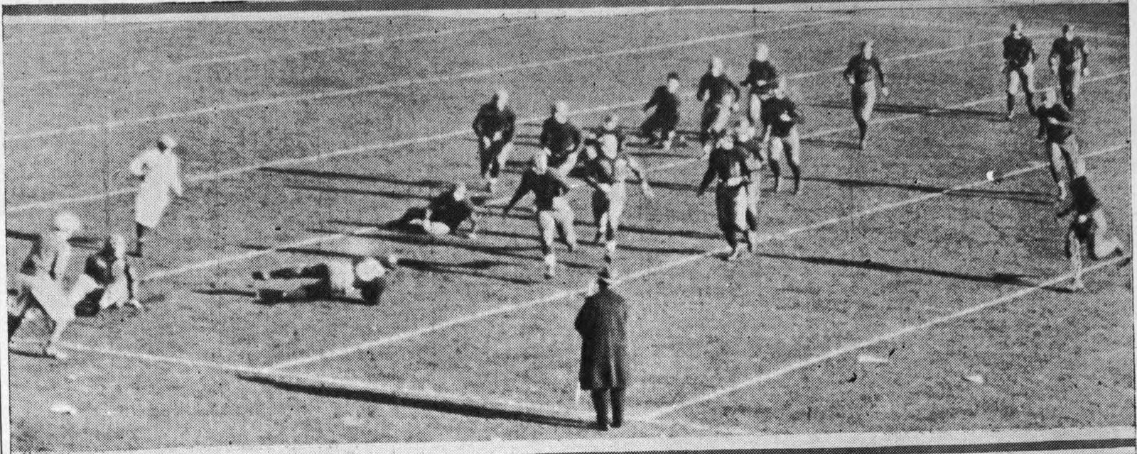 A Georgia Tech Golden Tornado football player making a 10-yard gain during their game against the Penn State Nittany Lions in Yankee Stadium in 1925