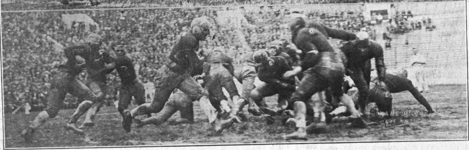The Georgia Tech Golden Tornado play the Florida Gators in 1925. In this image, Tech player Sam Murray goes through the center.