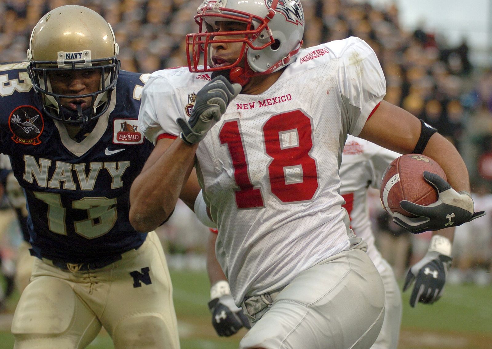 U.S. Naval Academy Midshipman safety Hunter Reddick chases down New Mexico wide receiver Hank Baskett.