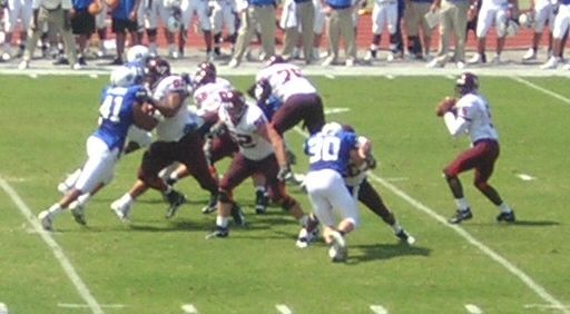 Marcus Vick (en) drops back to pass for the Virginia Tech Hokies against Duke University