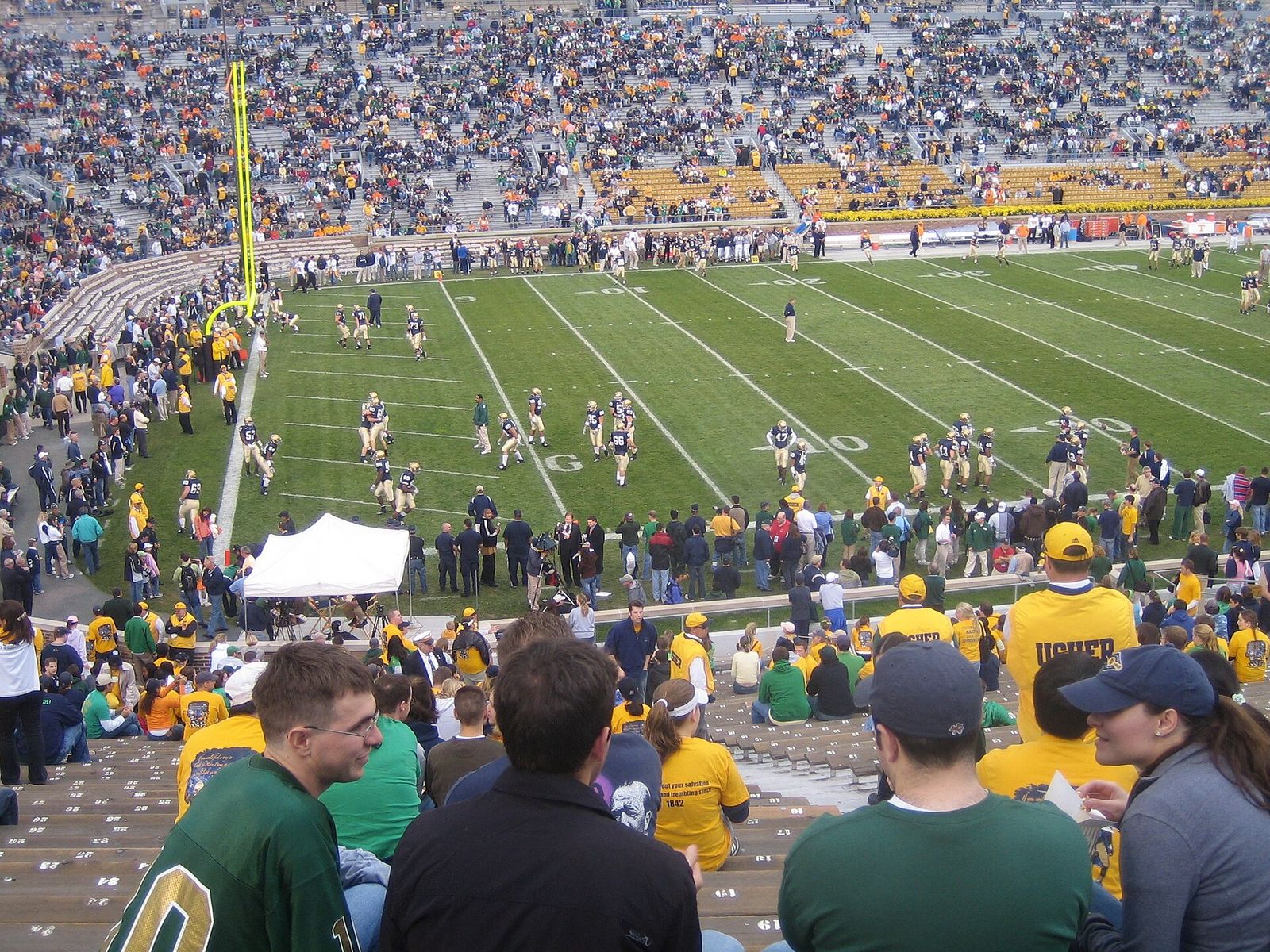 Before the game starts, in the soon to be crowded student section.
