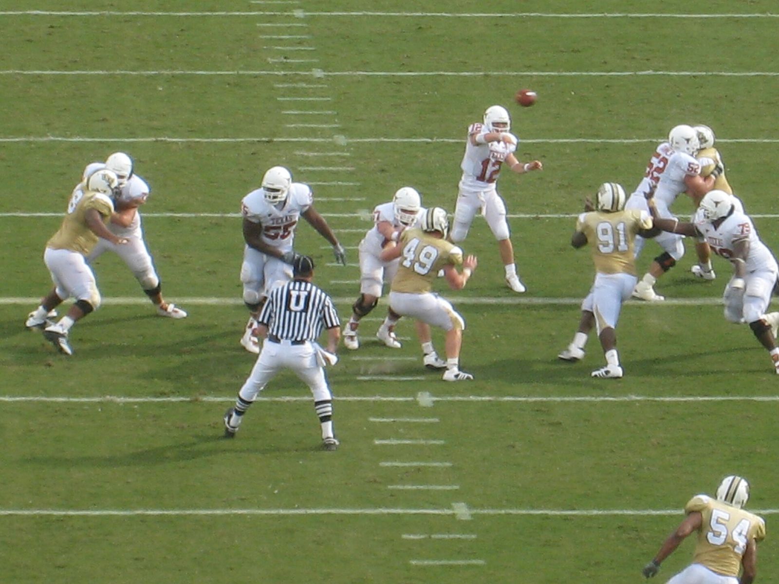 Colt McCoy throwing a pass against UCF