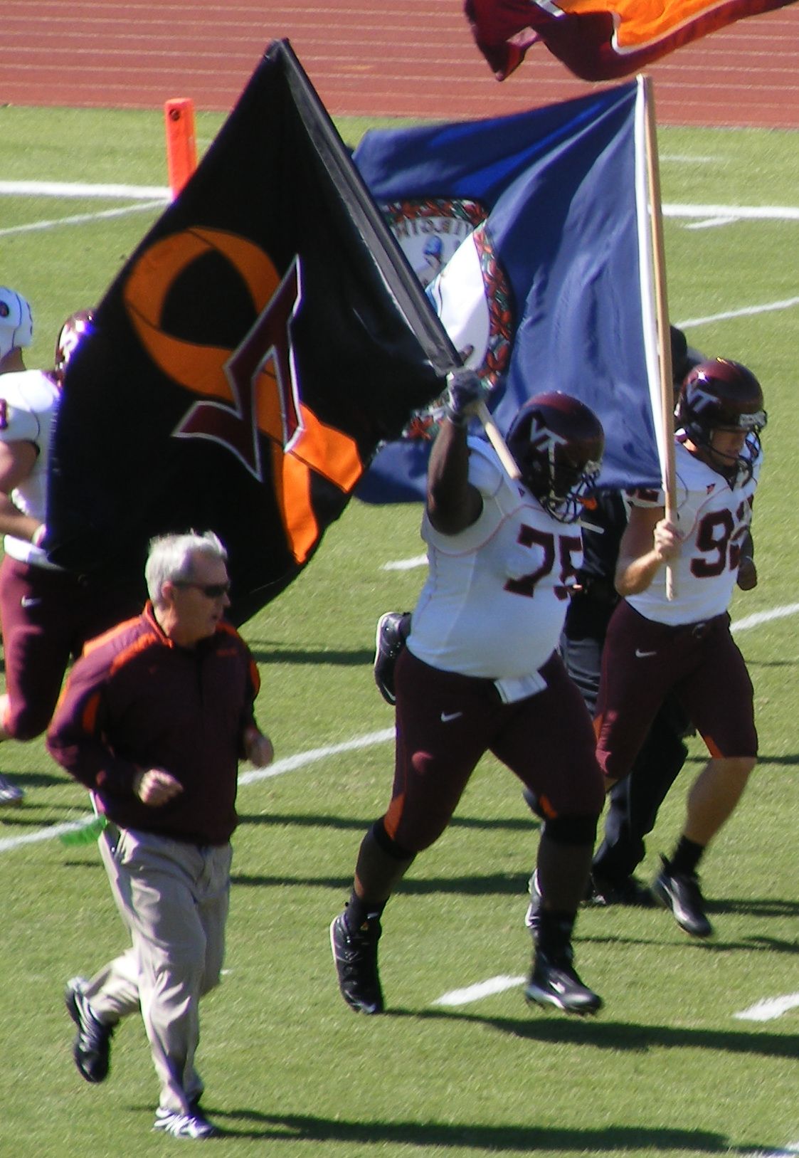 Virginia Tech Hokies football coach Frank Beamer (en) takes the field with his team