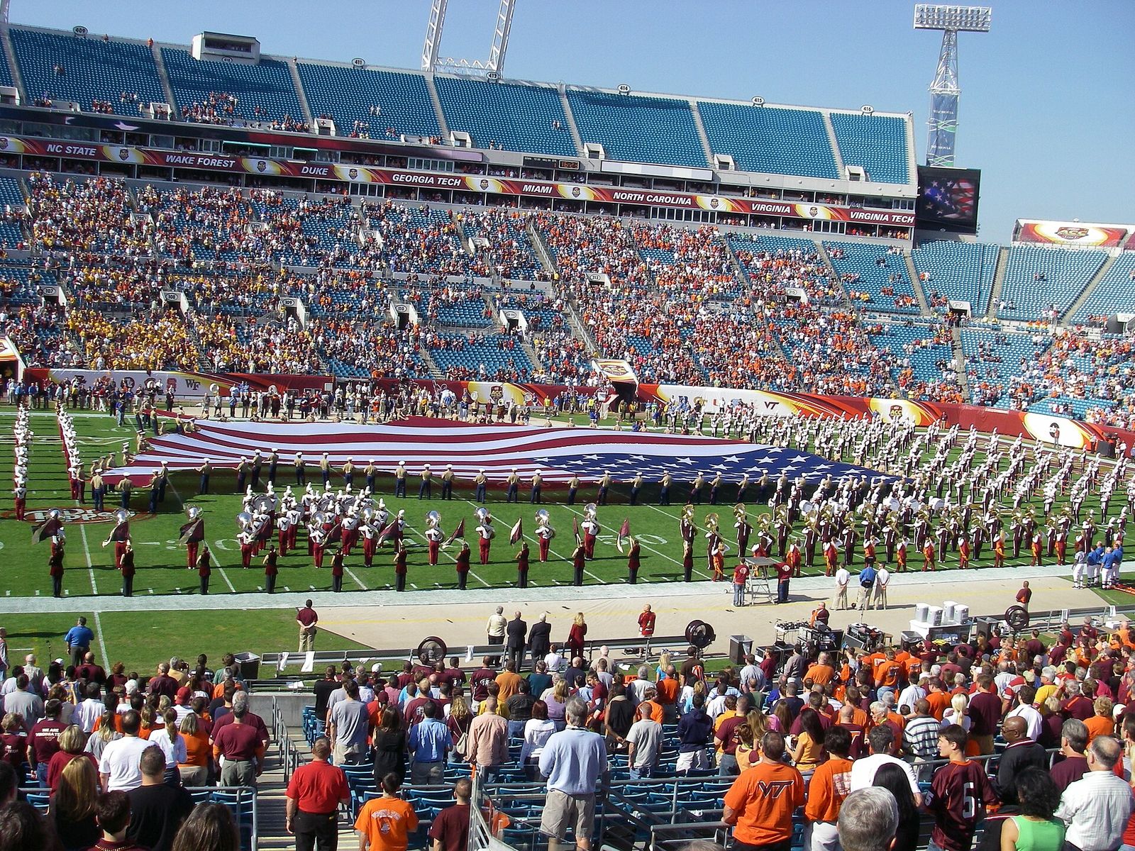 A giant American flag is stretched across the field during the playing of the national anthem prior to the 2007 ACC Championship Game.