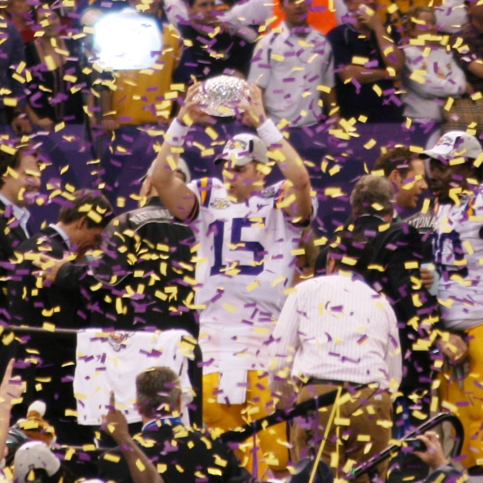 Quarterback Matt Flynn hoists the Crystal Trophy