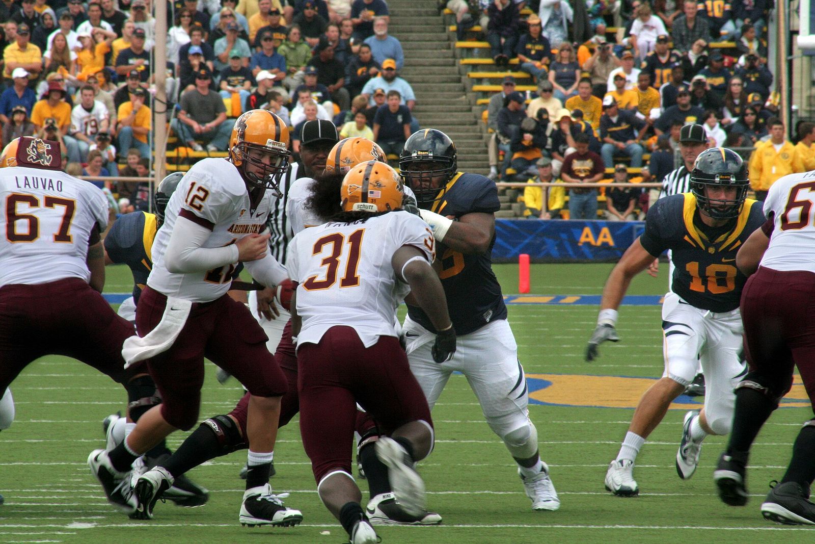 ASU quarterback Rudy Carpenter hands off to tailback Dimitri Nance in the 2008 game at Cal.