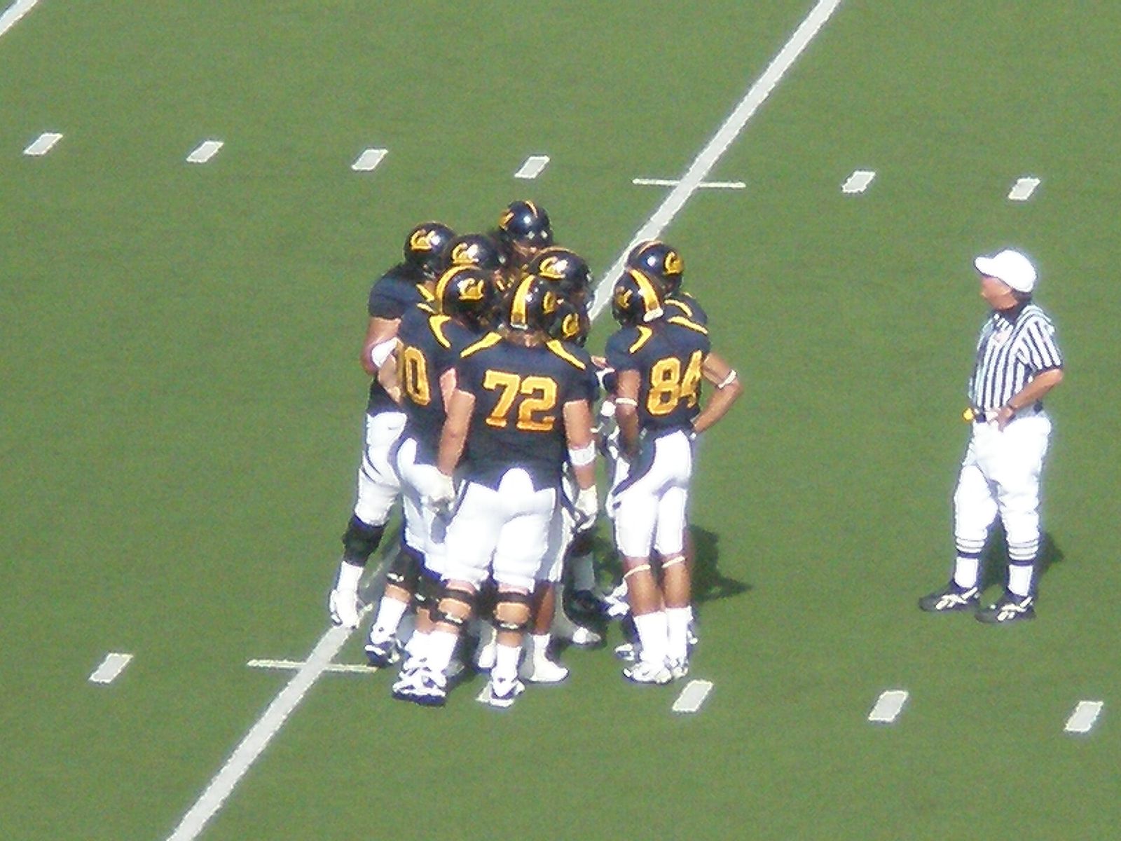 The Golden Bears huddle in a Cal home game against the Arizona State Sun Devils. The Golden Bears won 24-14.