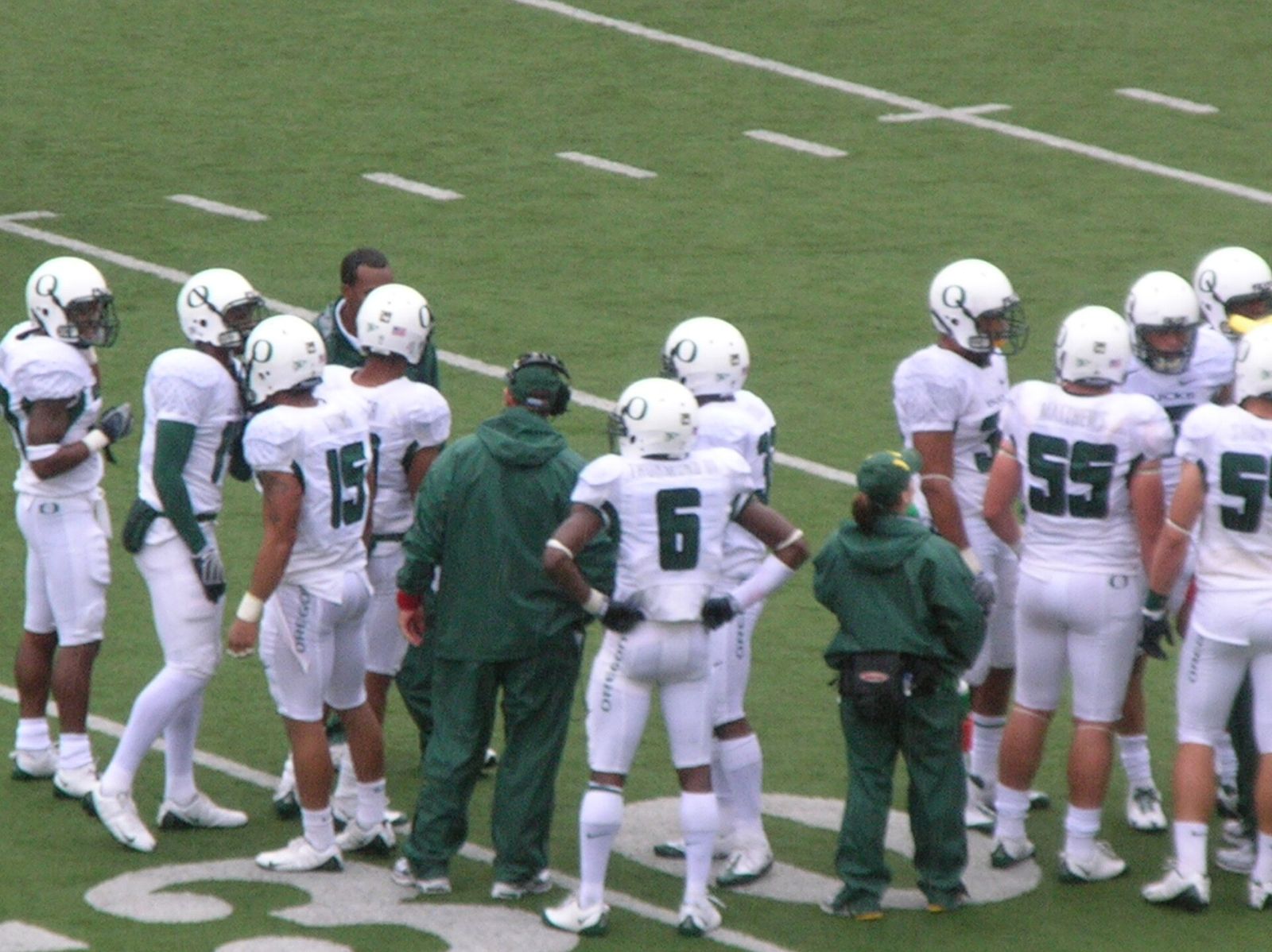The Oregon Ducks in the huddle at a road game in the rain at Cal. The Golden Bears won 26-16.