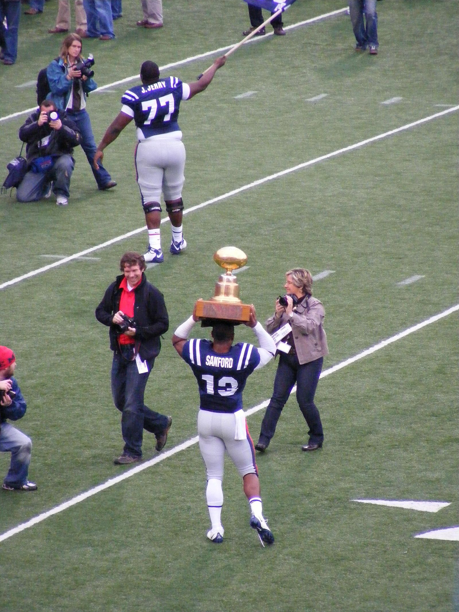 Ole Miss wins the 2008 Egg Bowl. Jamarca Sanford carries the Egg Bowl trophy while John Jerry waves an Ole Miss flag.