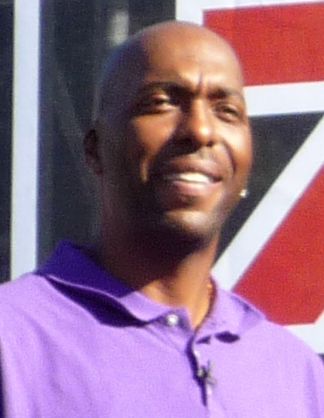 John Salley sports journalist, advertising on behalf of an electric shaver in the pre-game booths outside the 2008 USC-UCLA college football game.