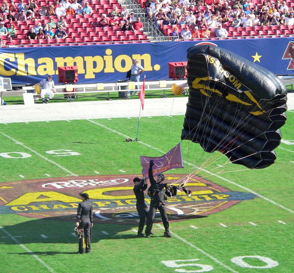 A parachutist lands at midfield of Raymond James Stadium prior to the 2008 ACC Championship Game.