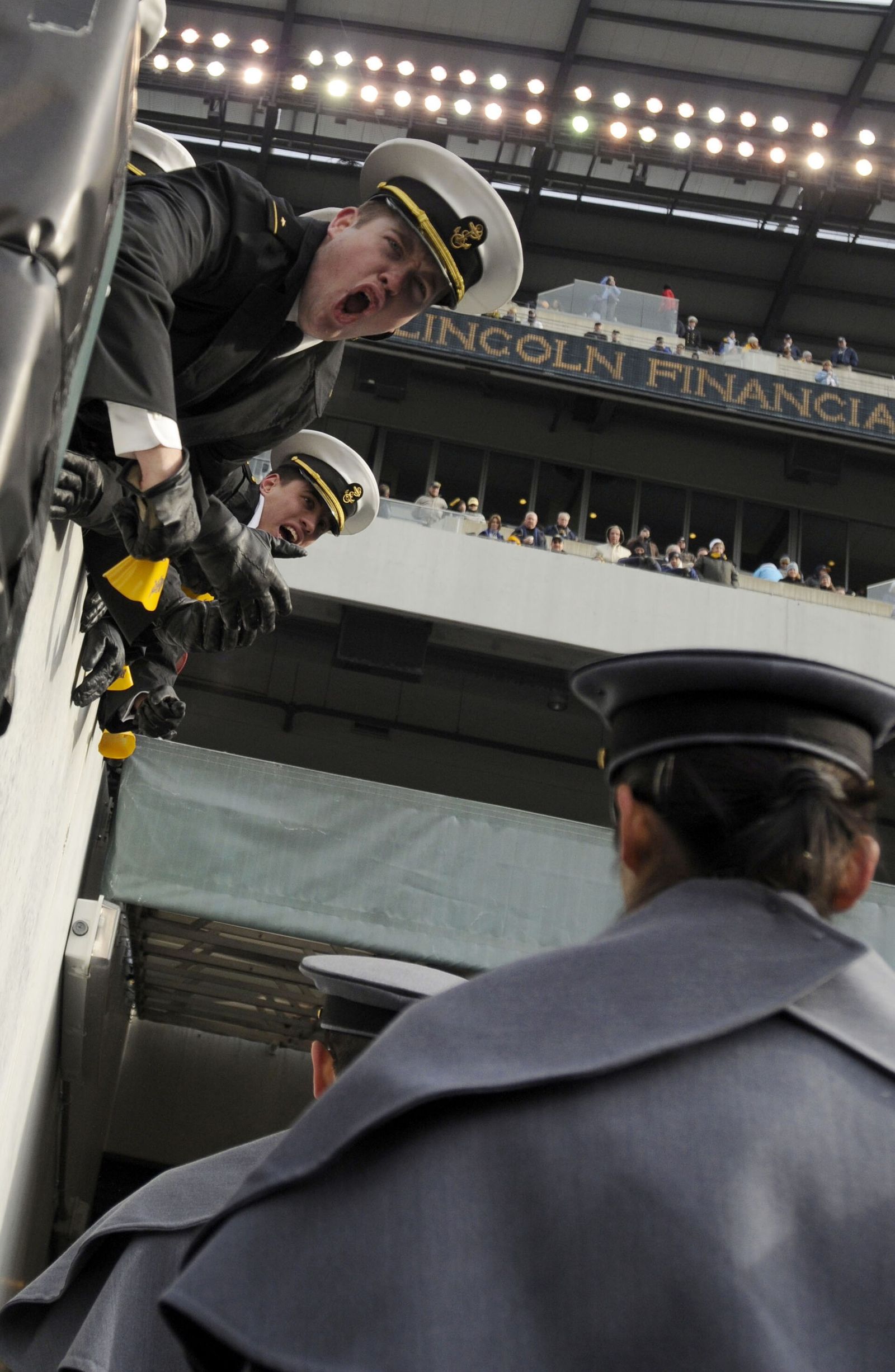 U.S. Naval Academy midshipmen taunt U.S. Military Academy cadets before the 109th Army-Navy college football game at Lincoln Financial Field in Philadelphia.
