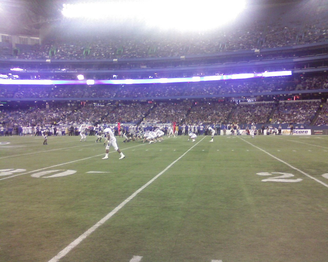 2008 Connecticut Huskies football team in blue versus 2008 Buffalo Bulls football team in white at the 2009 International Bowl