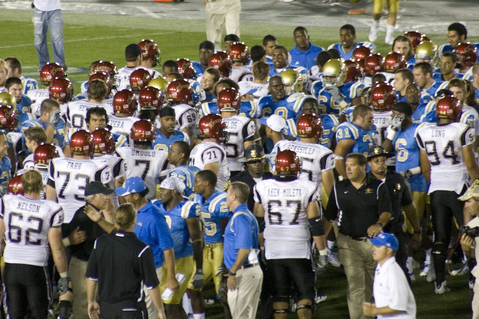 UCLA and San Diego State players and coaches shake hands after their game in September 2009.