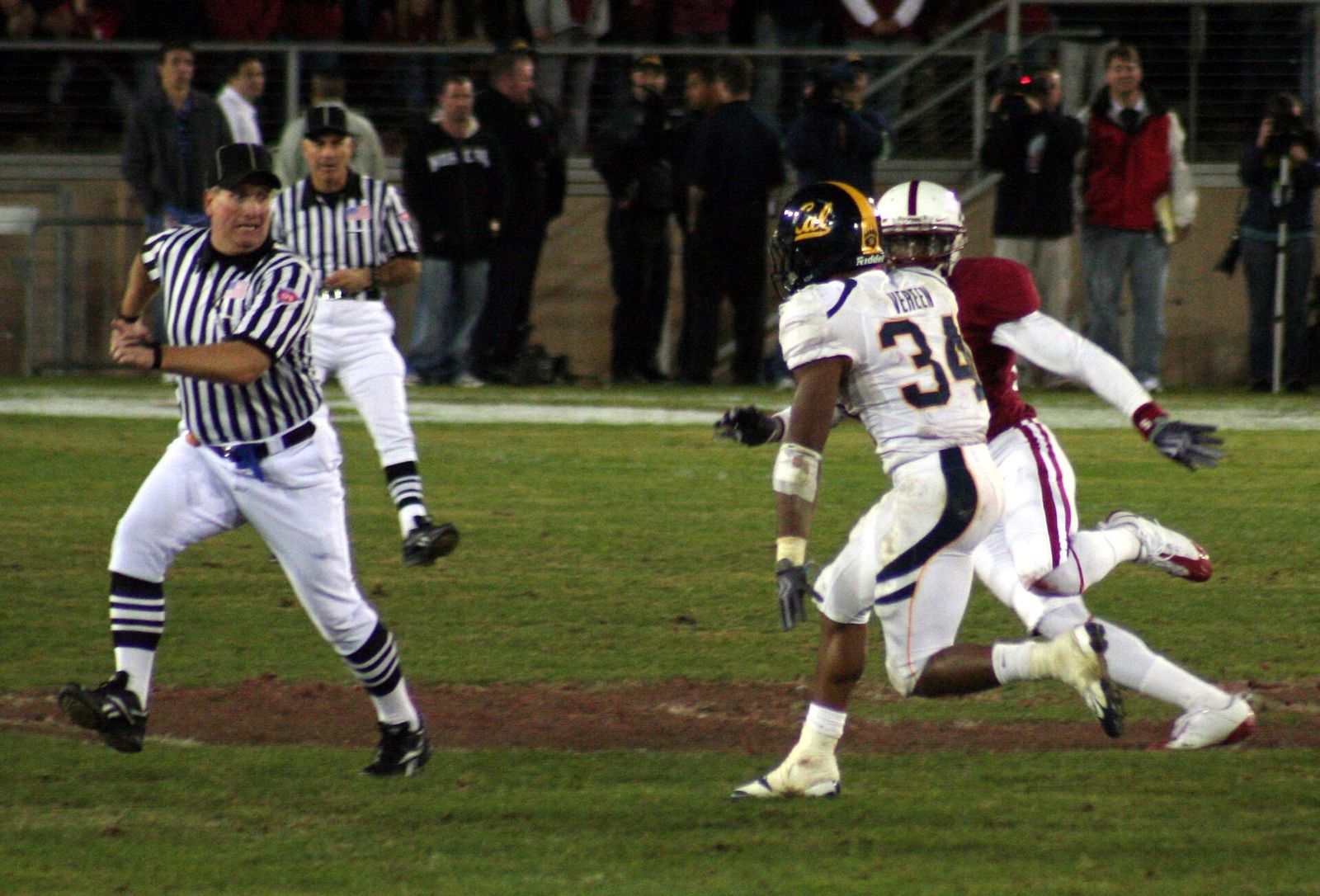 The official is terrified, but he's going to help the defender out big-time...