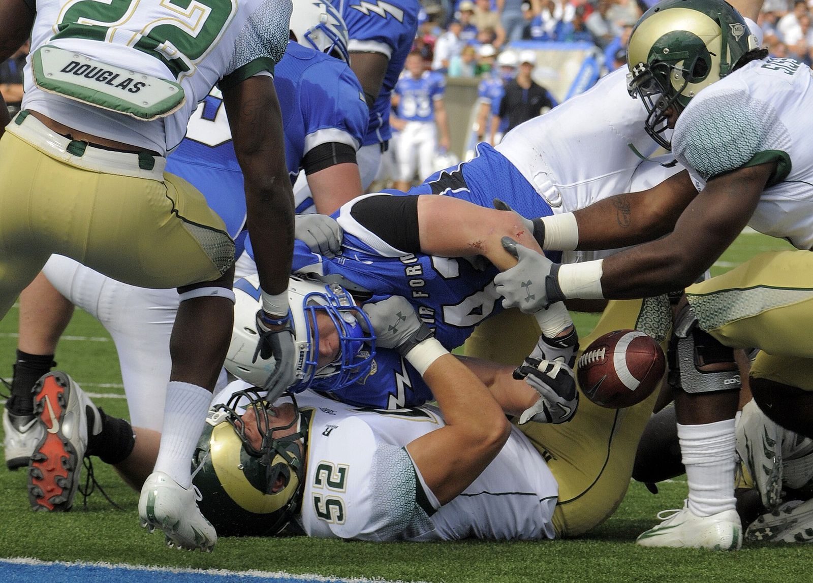 Falcons fullback Jared Tew loses the football during the Air Force-Colorado State game at Falcon Stadium. Air Force won 49-27.