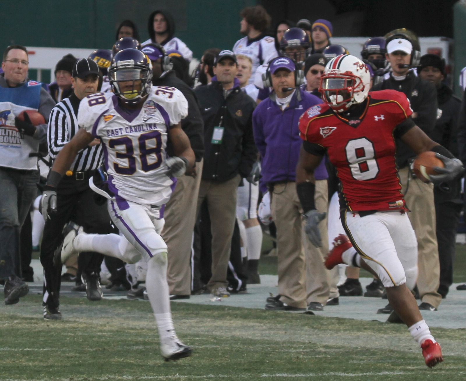 Davin Meggett (right) of the Maryland Terrapins is pursued by Emanuel Davis (left) of the East Carolina Pirates during the 2010 Military Bowl.