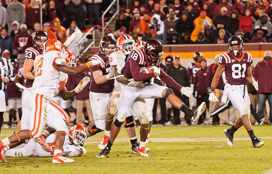 D.J. Coles of Virginia Tech with the ball. Jarrett Boykin (81) also in the picture.