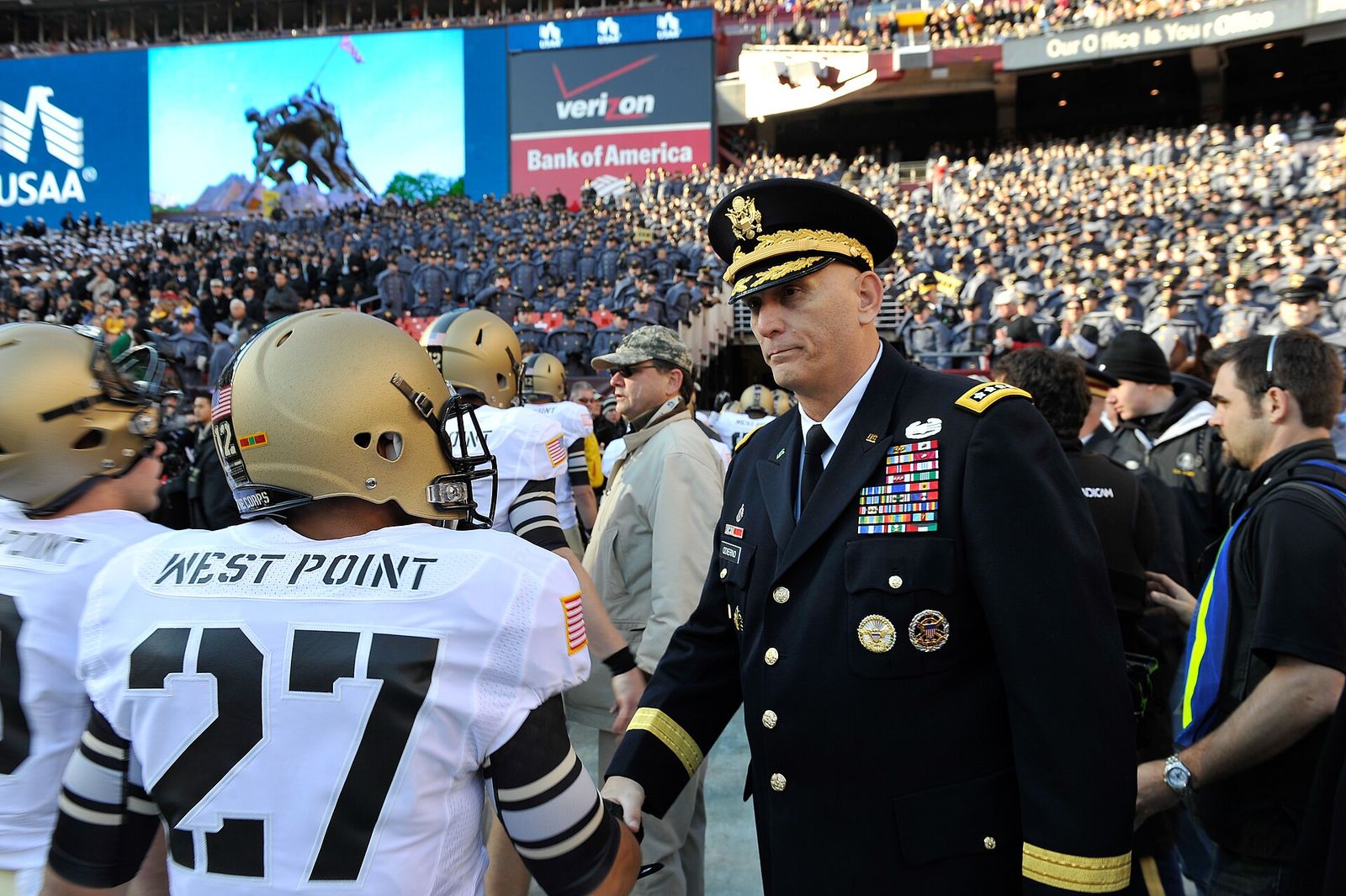 U.S. Army Chief of Staff Gen. Raymond T. Odierno greets Army Black Knights before the start of the Army vs Navy game Dec. 10 at FedEx field in Landover, Md.