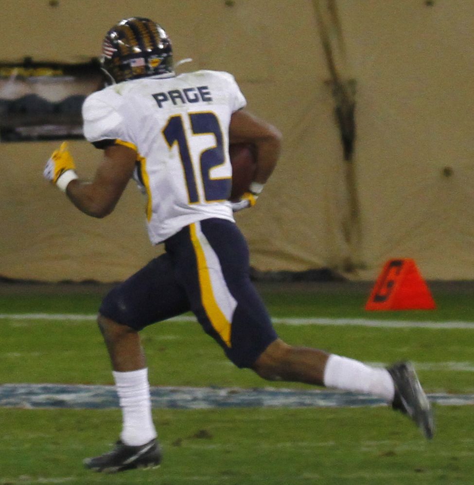 Eric Page of the Toledo Rockets is pursued by Air Force Falcons defenders during the 2011 Military Bowl at RFK Stadium in Washington, D.C.