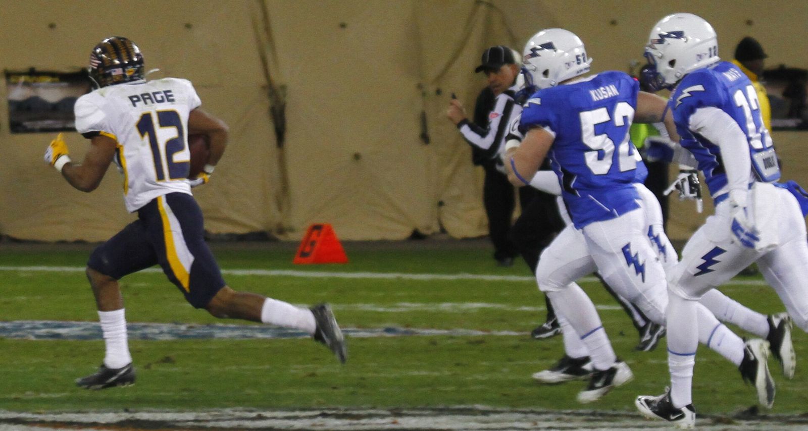 Eric Page of the Toledo Rockets is pursued by Air Force Falcons defenders during the 2011 Military Bowl at RFK Stadium in Washington, D.C.