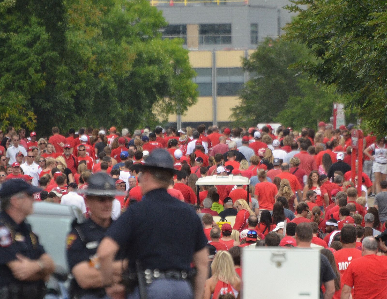 Badger football fans on Breese Terrace below Camp Randall Stadium shortly before the start of a game