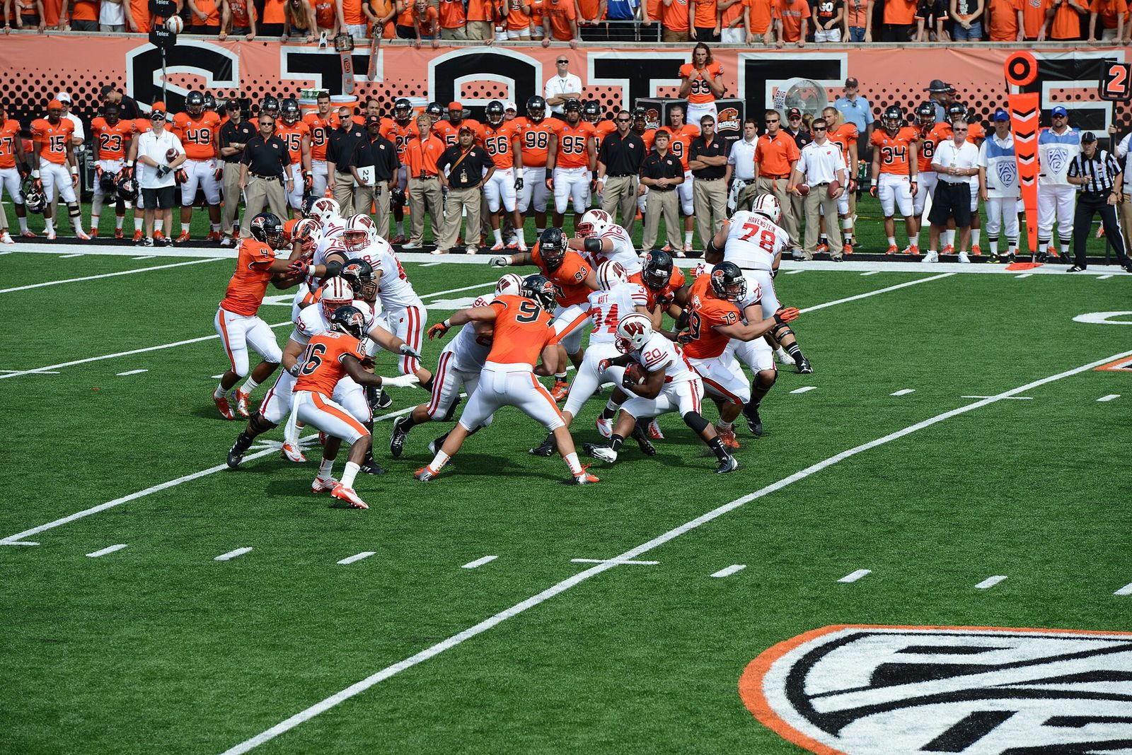The Wisconsin Badgers running back James White #20 running the football against the Oregon State Beavers defense in 2012
