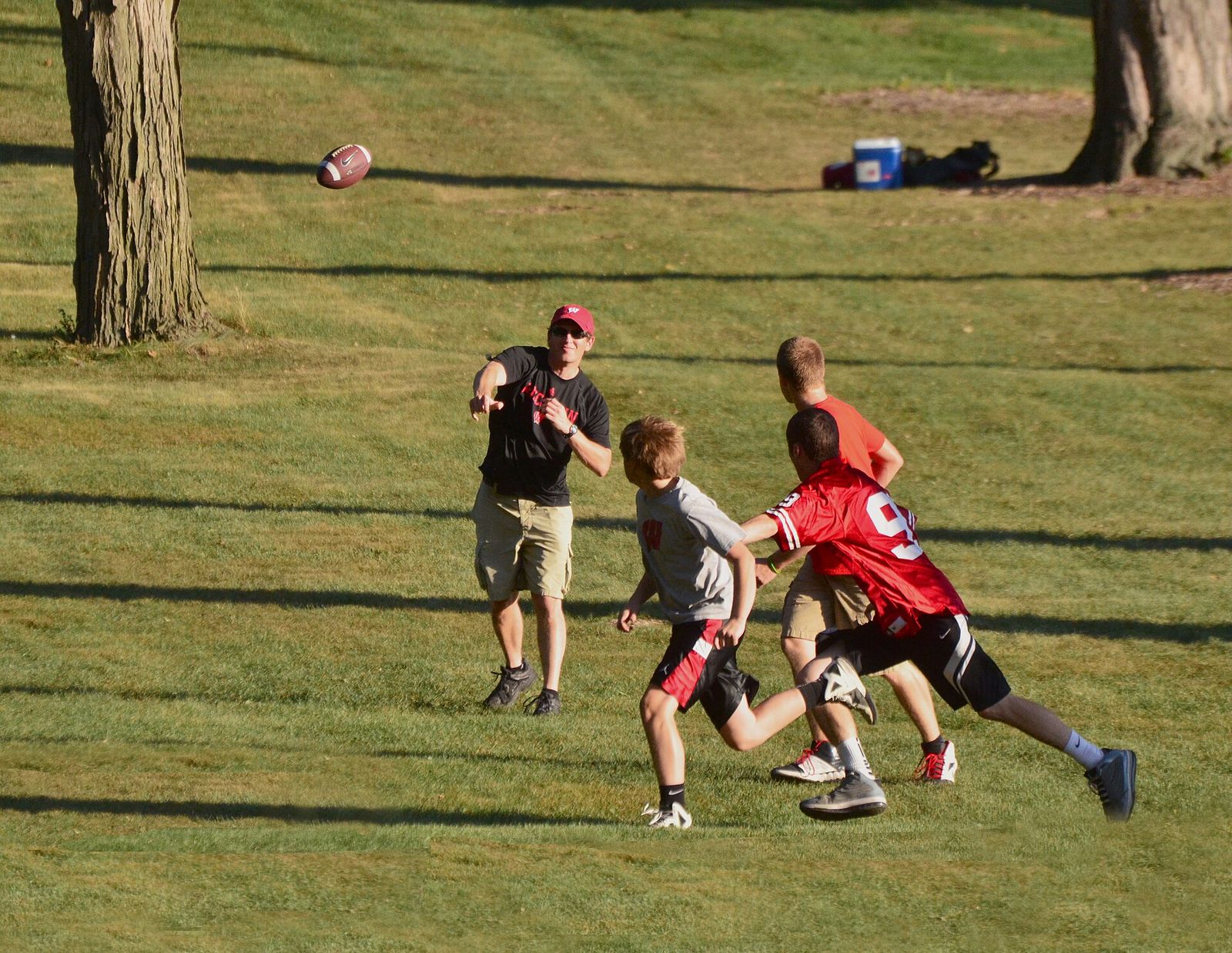 Wisconsin Badgers football fans in pre-game warm-up drills on the lawn of Edgewood College in Madison