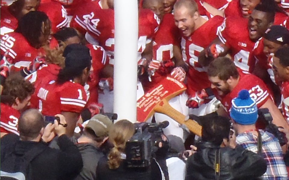 Wisconsin linebacker Mike Taylor pretends to chop down the goalpost with The Axe following Wisconsin's 38-13 victory over Minnesota in 2012.