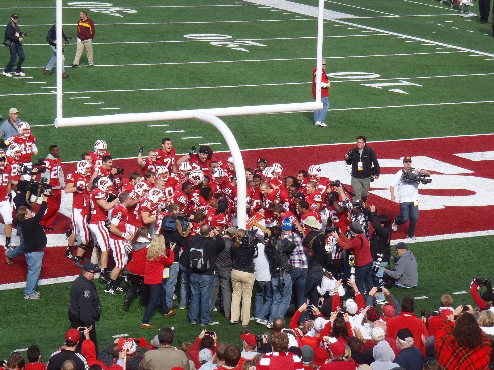 Wisconsin linebacker Mike Taylor pretends to chop down the goalpost with The Axe following Wisconsin's 38-13 victory over Minnesota in 2012.