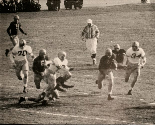 A Navy player makes a run down the field in the 1954 Army-Navy Game. Navy won, 27-20