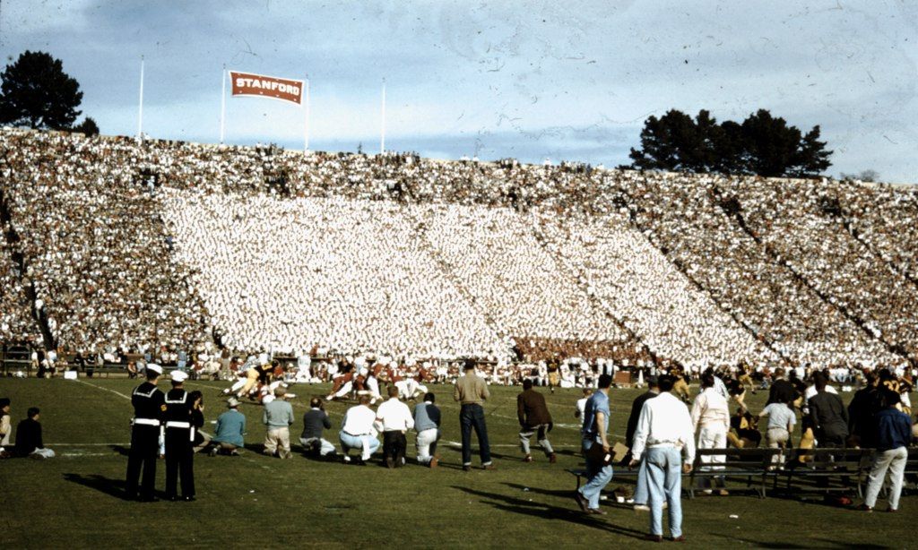 Some action at the Big Game. Look closely at the lower left for the two teams colliding during the game, but I have no clue as to the play or even which half.