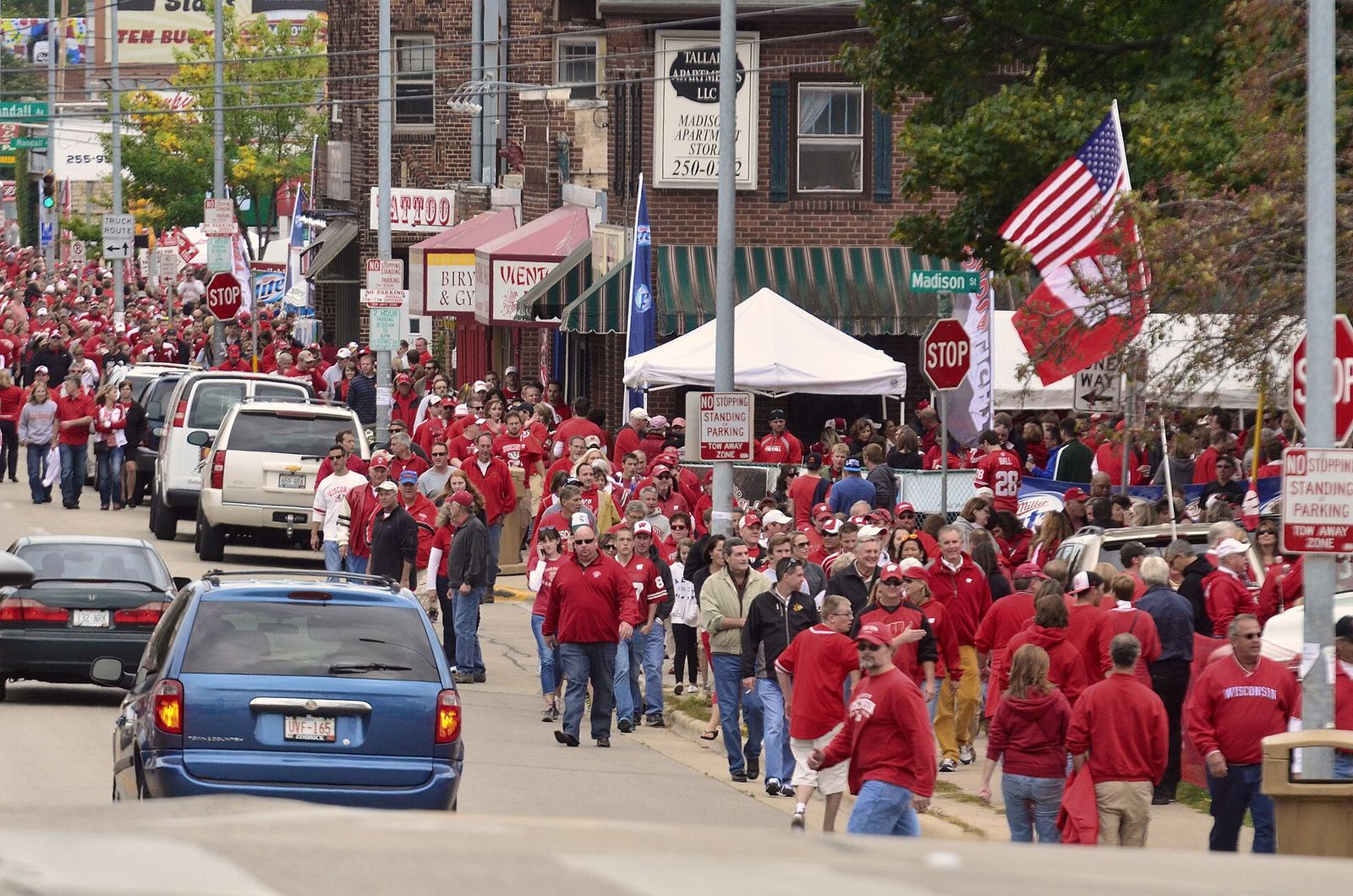 Badger football fans on Regent Street making their way to Camp Randall Stadium prior to the start of a game