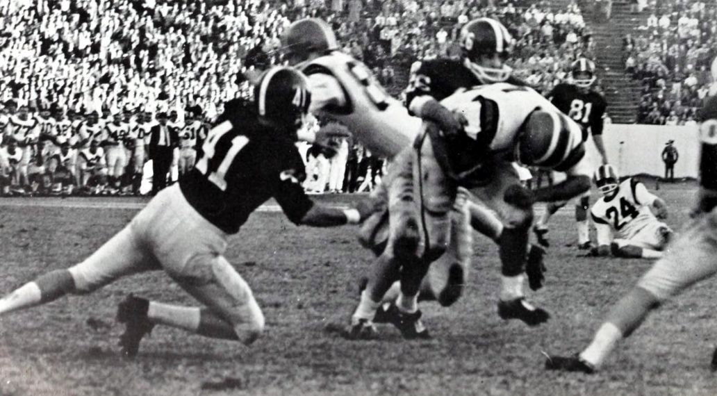 A TCU defender tackles a Clemson ball carrier in the 1959 Bluebonnet Bowl.