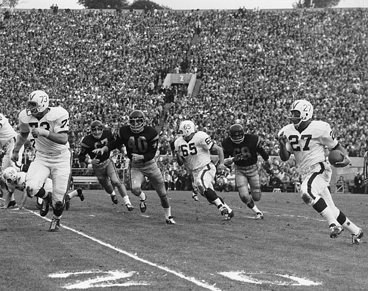 1963 Rose Bowl Game Action with Lou Holland of the University of Wisconsin--Madison Badgers running around the end. University of Wisconsin Digital Collections