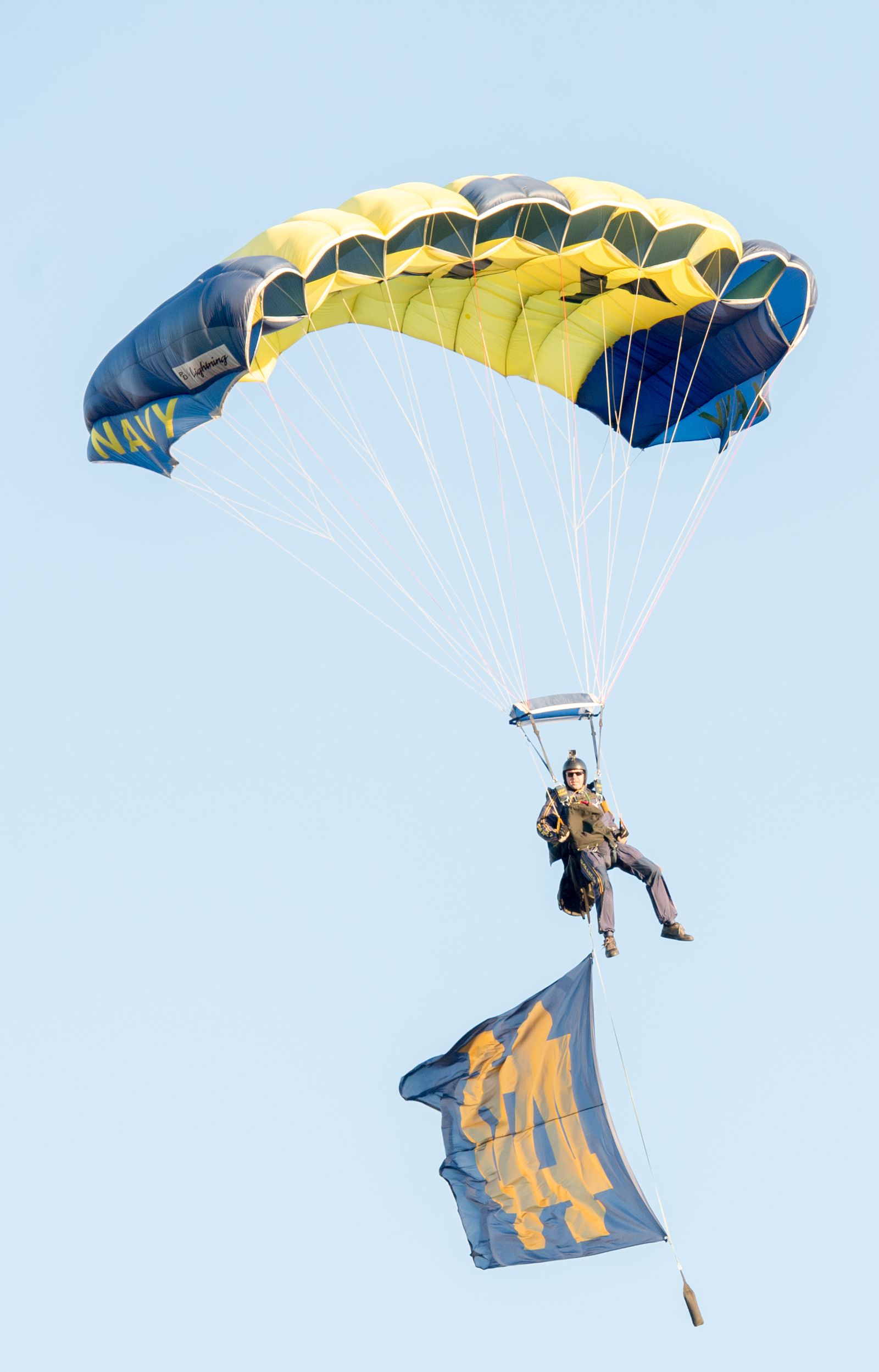 A U.S. Sailor with the Leap Frogs parachutes onto the field at Notre Dame Stadium in South Bend, Ind., Sept. 6, 2014, before a football game.