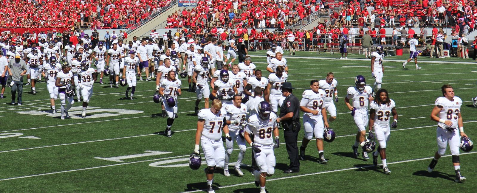 The Western Illinois Leathernecks football team leaves the field at Camp Randall Stadium after playing the Wisconsin Badgers.