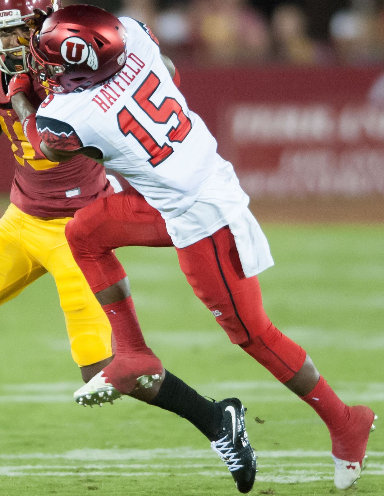 Dominique Hatfield of Utah attempts to tackle a USC ball-carrier during an October 2015 game at Los Angeles Coliseum.