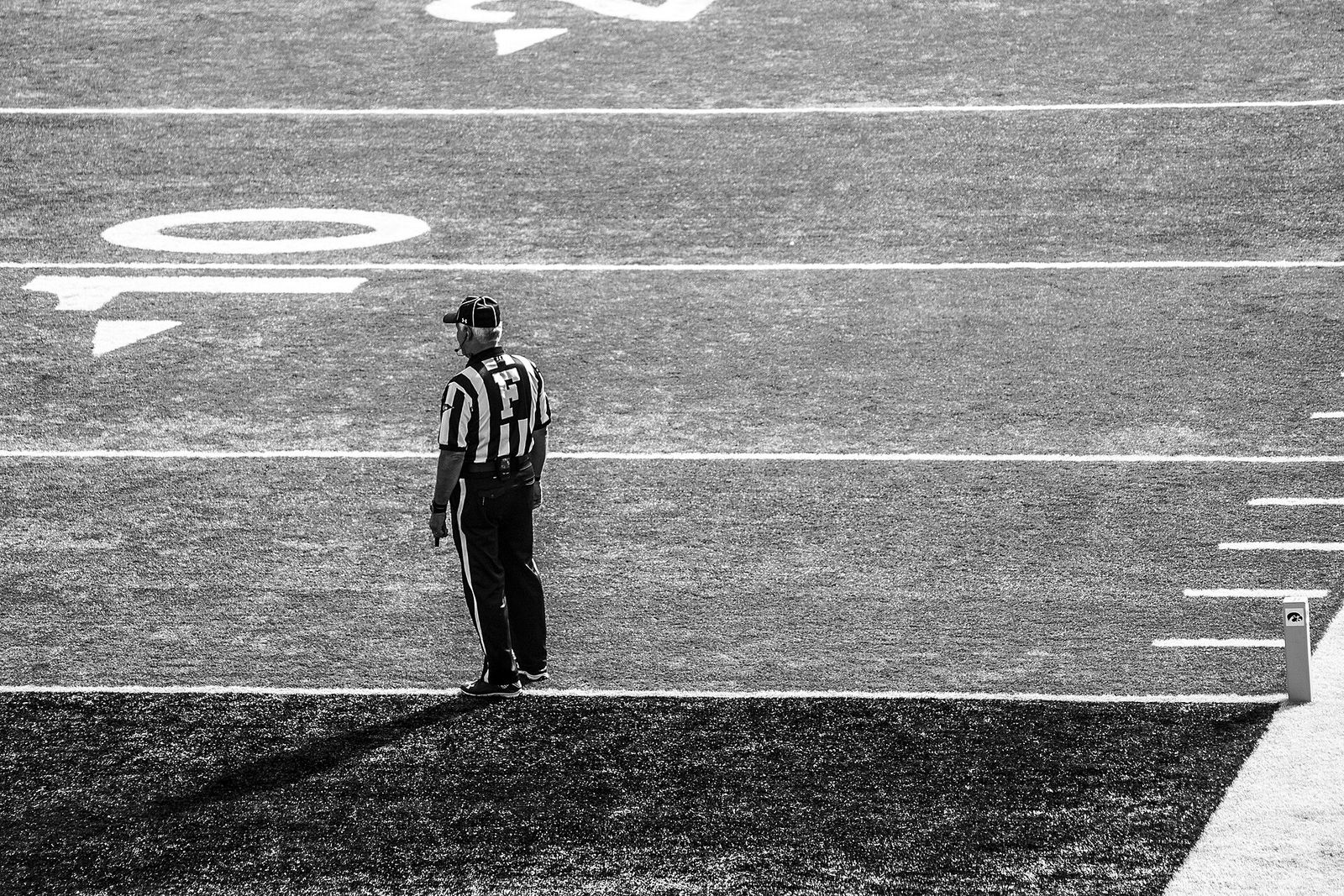 A ref appears all along on the goal line during a University of Iowa football game.