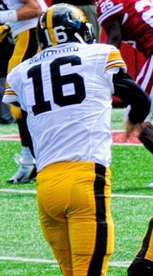 UW Badgers vs Iowa Hawkeyes, OLB Joe Schobert, UW # 58, trying to block a pass from QB Beathard, IOWA # 16