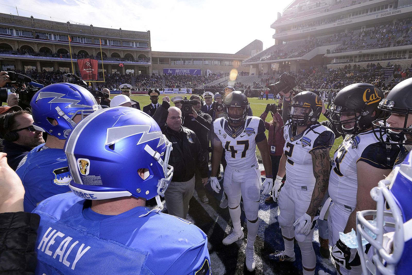 The Air Force Falcons and Cal Golden Bears meet at midfield for the coin toss before the 2015 Armed Forces Bowl