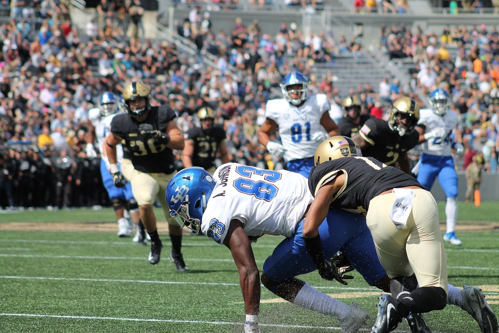 Wide receiver Anthony Johnson of the Buffalo Bulls is tackled by an Army Black Knights defender during a 2017 game at Michie Stadium in West Point.