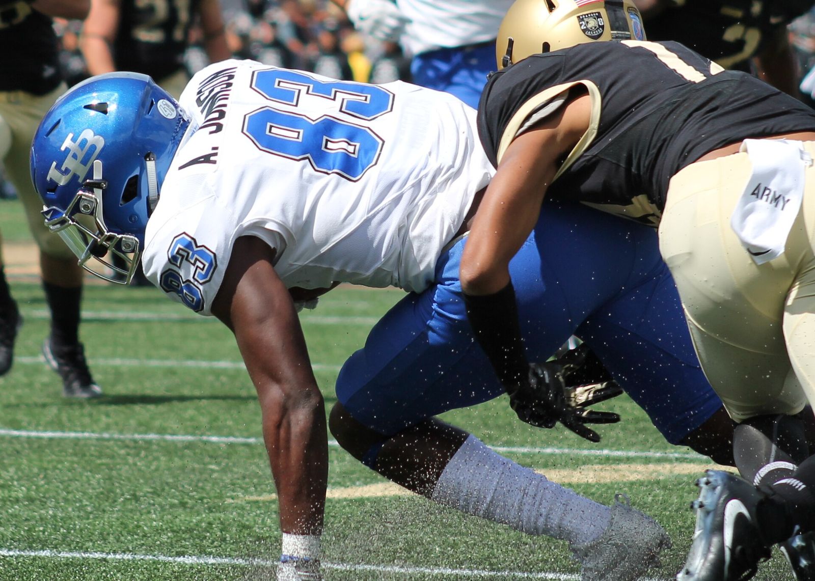 Wide receiver Anthony Johnson of the Buffalo Bulls is tackled by an Army Black Knights defender during a 2017 game at Michie Stadium in West Point.