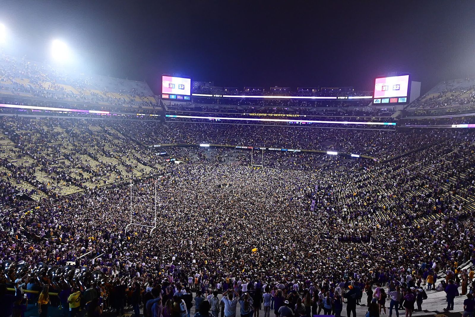 Fan photo of LSU fans rushing the field following 32-31 win vs. Alabama in 2022