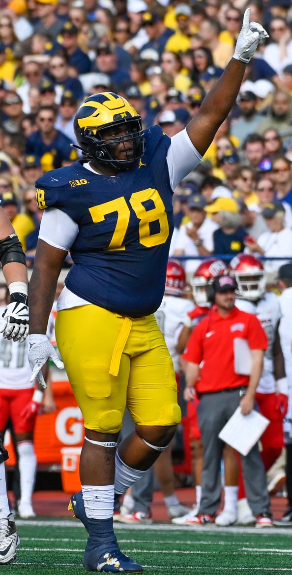 Kenneth Grant celebrates a tackle during a September 2023 football game against the UNLV Rebels at Michigan Stadium.
